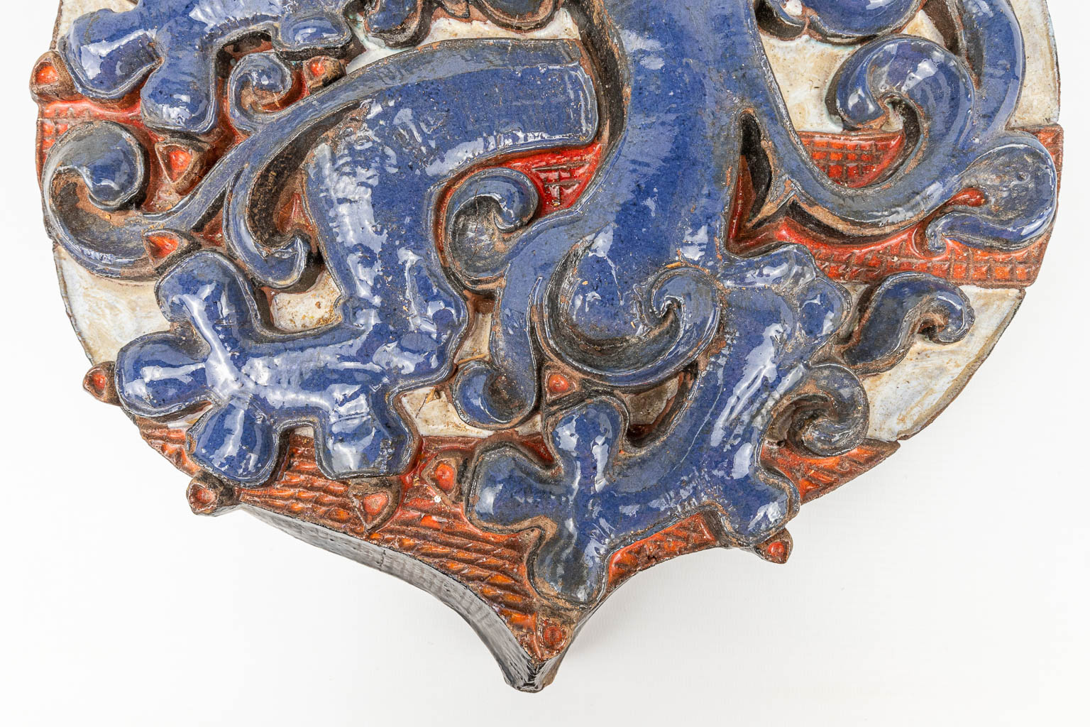A large glazed terracotta coat of arms, 