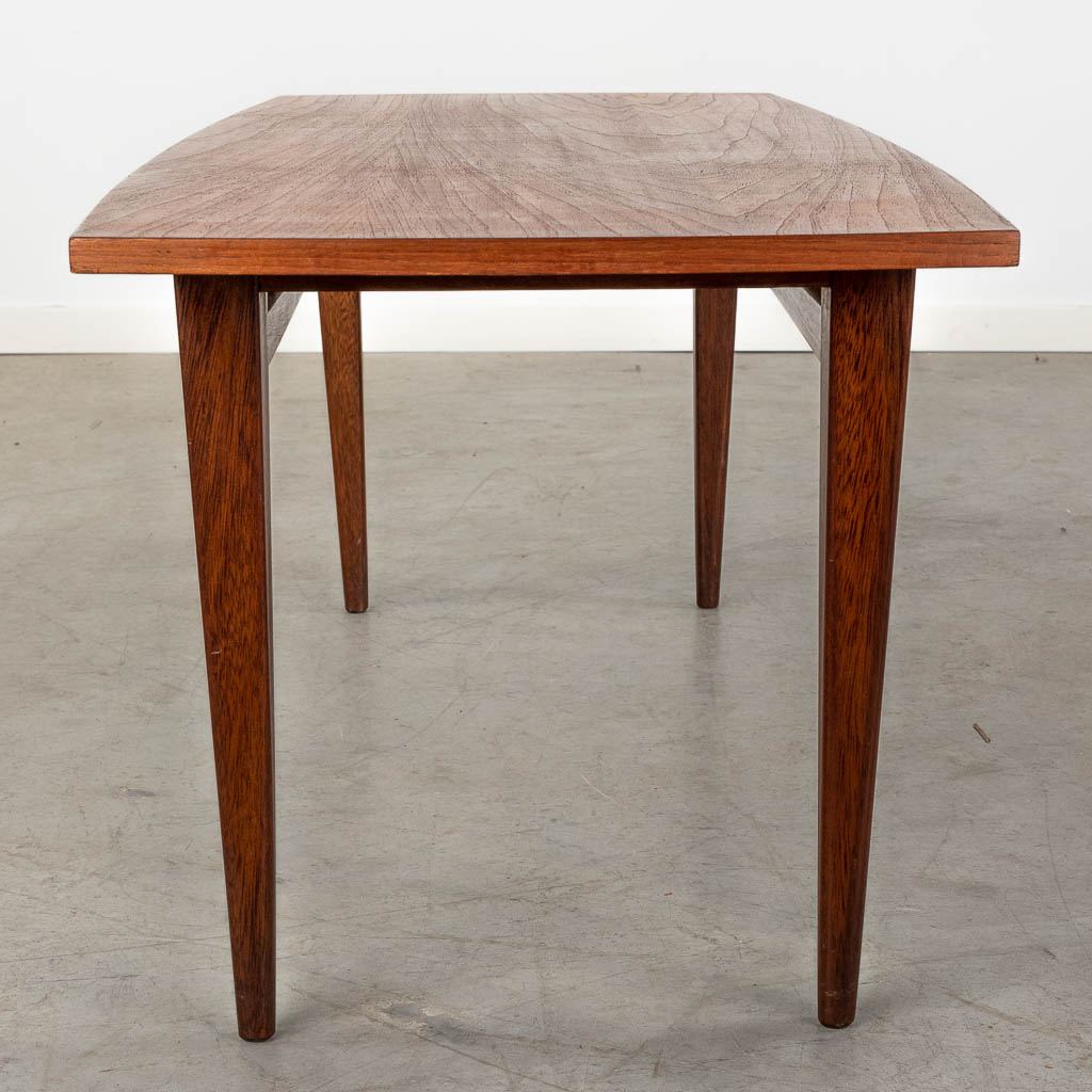 A mid-century Scandinavian coffee table, probably solid teak. (D:50 x W:120 x H:45 cm)
