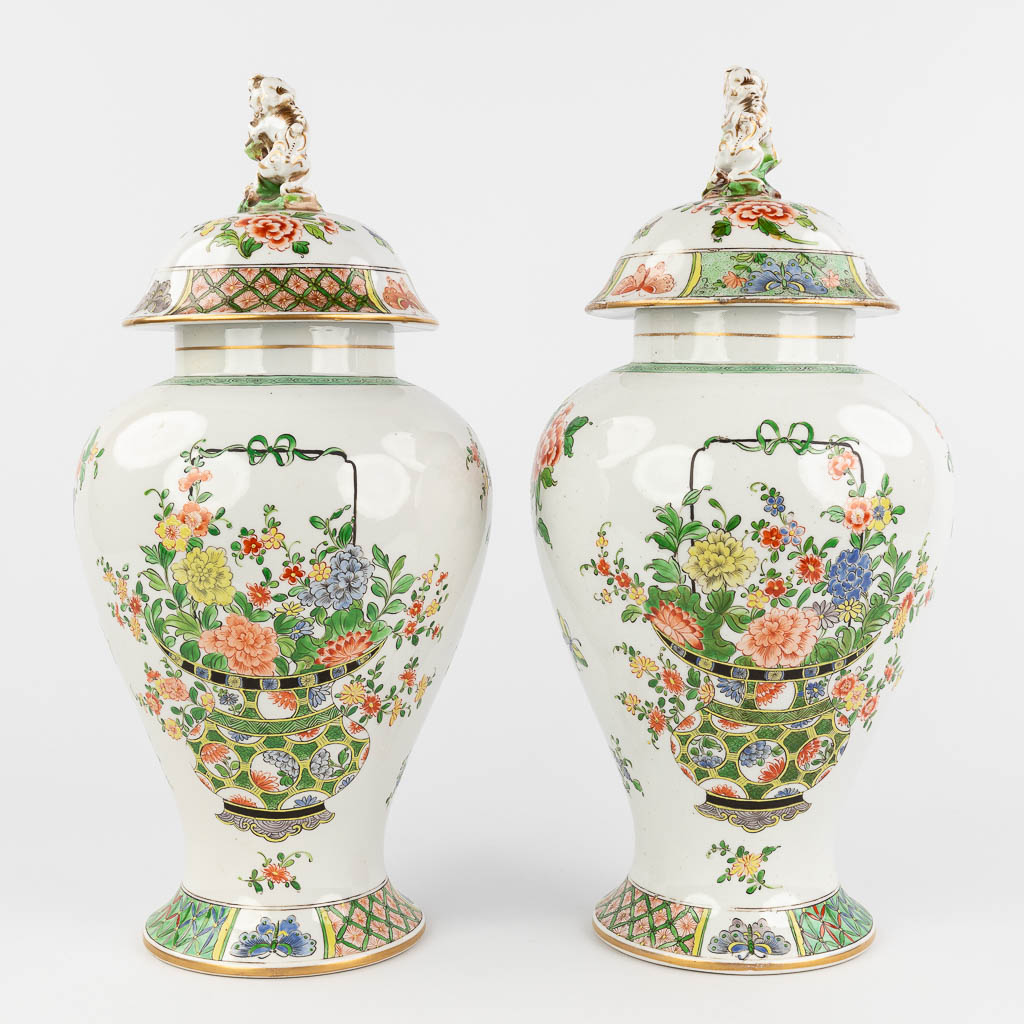 Pair of Chinese-style vases, porcelain with hand-painted flower decor. Probably Samson, France. (H: 41 x D: 19 cm)