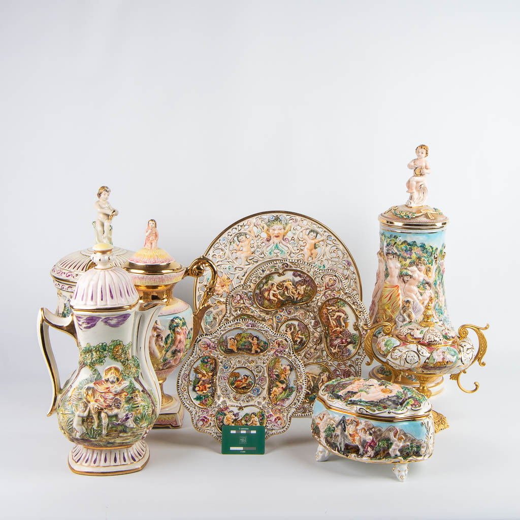An assembled lot of 9 pieces of faience made by Capodimonte in Italy. (H:60cm)