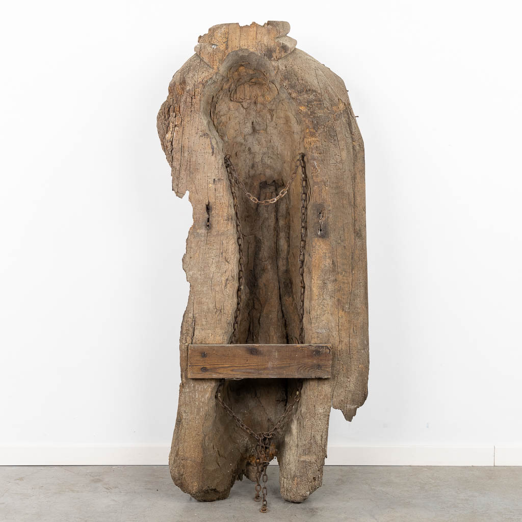 The antique remains of a wood sculptured angel or saint, 16th/17th C. (L:38 x W:63 x H:147 cm)