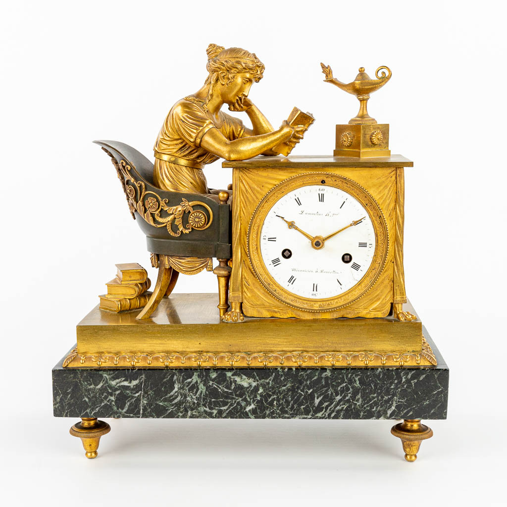A table clock made of gilt bronze 'La Liseuze' after a model by Jean-André REICHE (1752-1817), Empire Period. (H:33cm