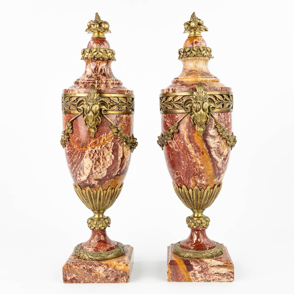 A pair of red marble cassolettes decorated with gilt bronze ram