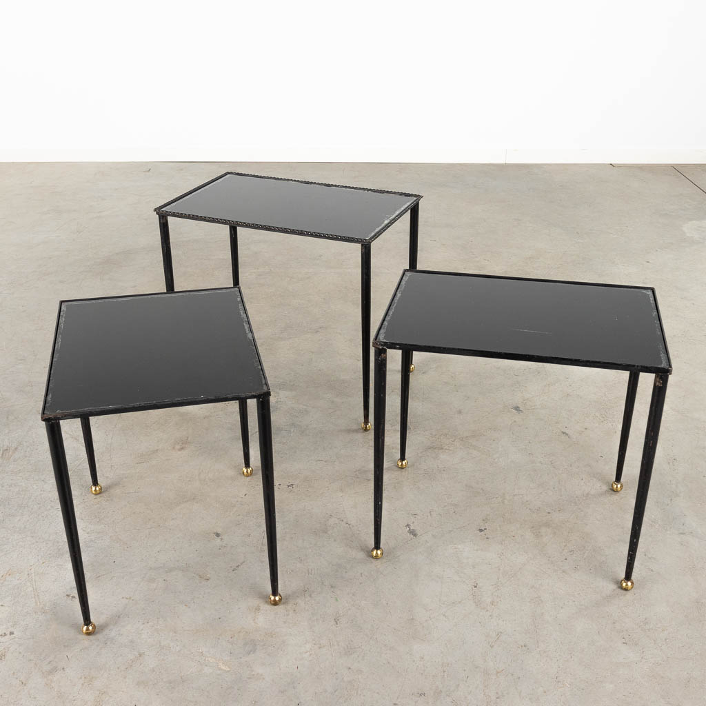 A set of Nesting tables, metal and black tinted glass. 20th C. (D:56 x W:37 x H:50 cm)
