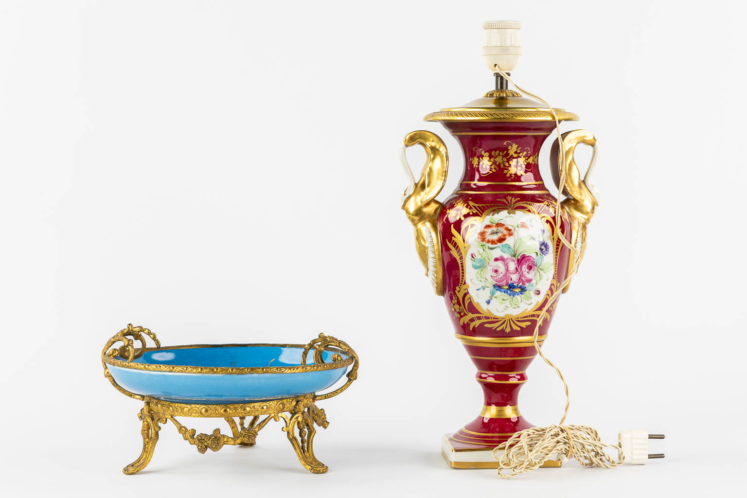 Limoges and Sèvres marks, a lamp base and a tazza with a hand-painted flower decor. (H:40 cm)