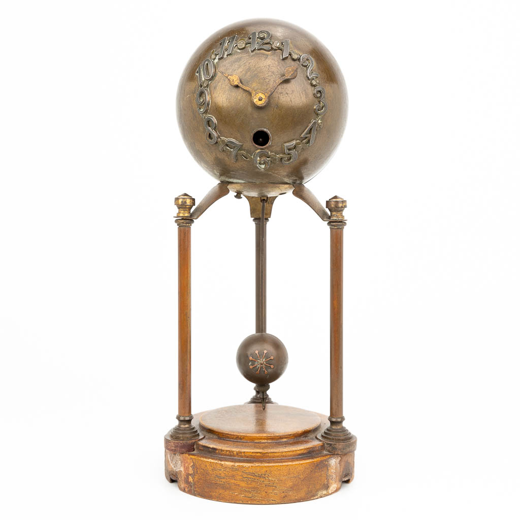 An antique table clock with a ball made in art nouveau style, Amsterdam School. (H:26cm)
