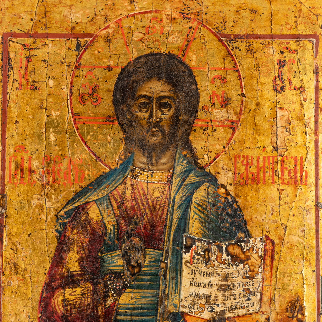 A small Eastern European icon of Jesus Christ, mounted in a gilt frame. 19th C. (W:21,5 x H:25 cm)