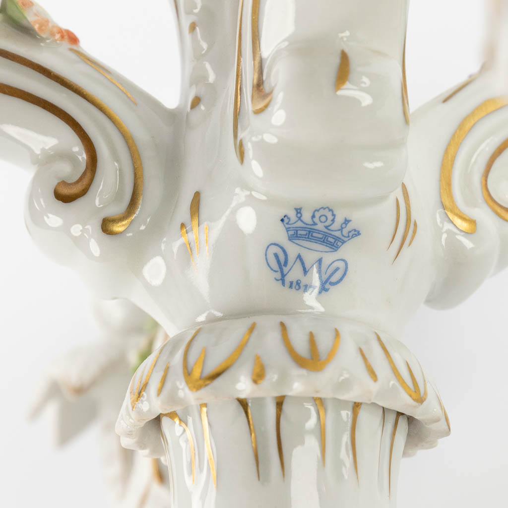 A pair of candelabra, polychrome porcelain decorated with figurines. Marked PMP, 20th C. (D:37 x W:37 x H:49 cm)