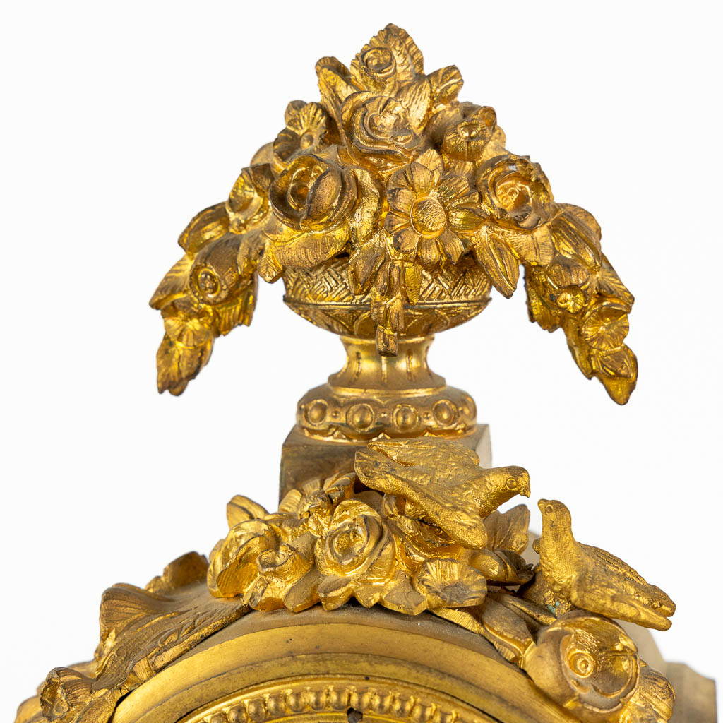 A mantle clock, gilt bronze finished with Sèvres porcelain plaques, 19th C. (L:16 x W:45 x H:35 cm)