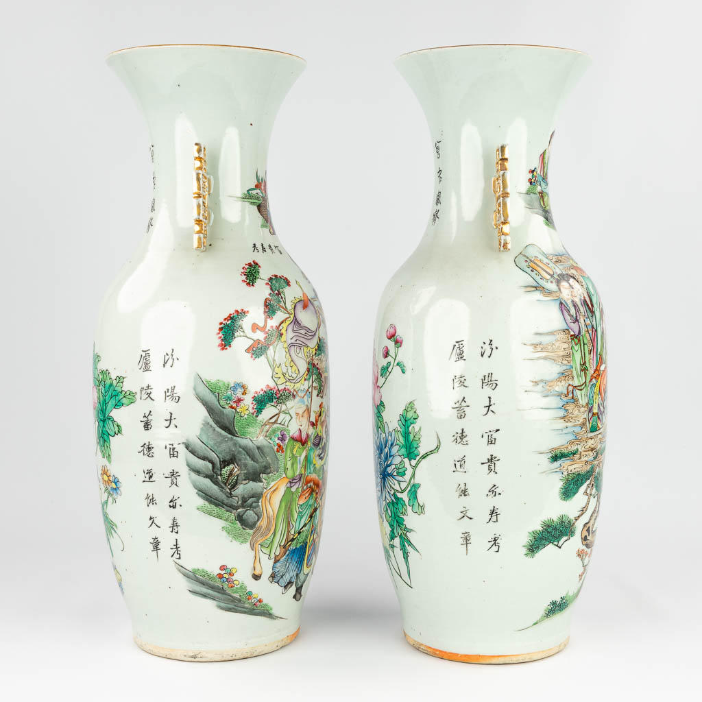 A pair of Chinese vases with a double decor of warriors and ladies, Fauna and flora. 19th/20th C. (H: 59 x D: 22,5 cm)