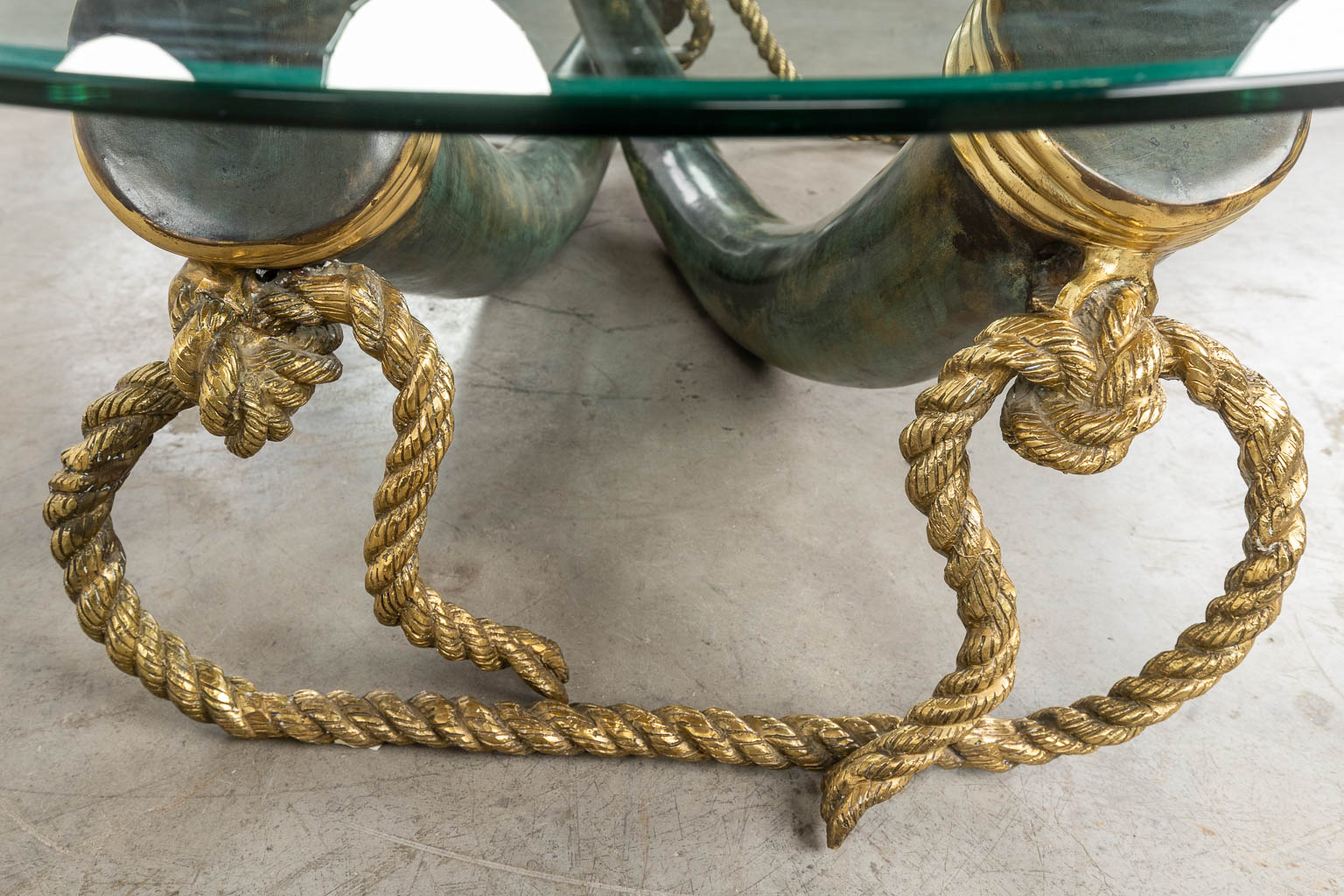 A coffee table, faux tusks, bronze, Valenti, Spain. Circa 1980. (D:100 x W:168 x H:40 cm)