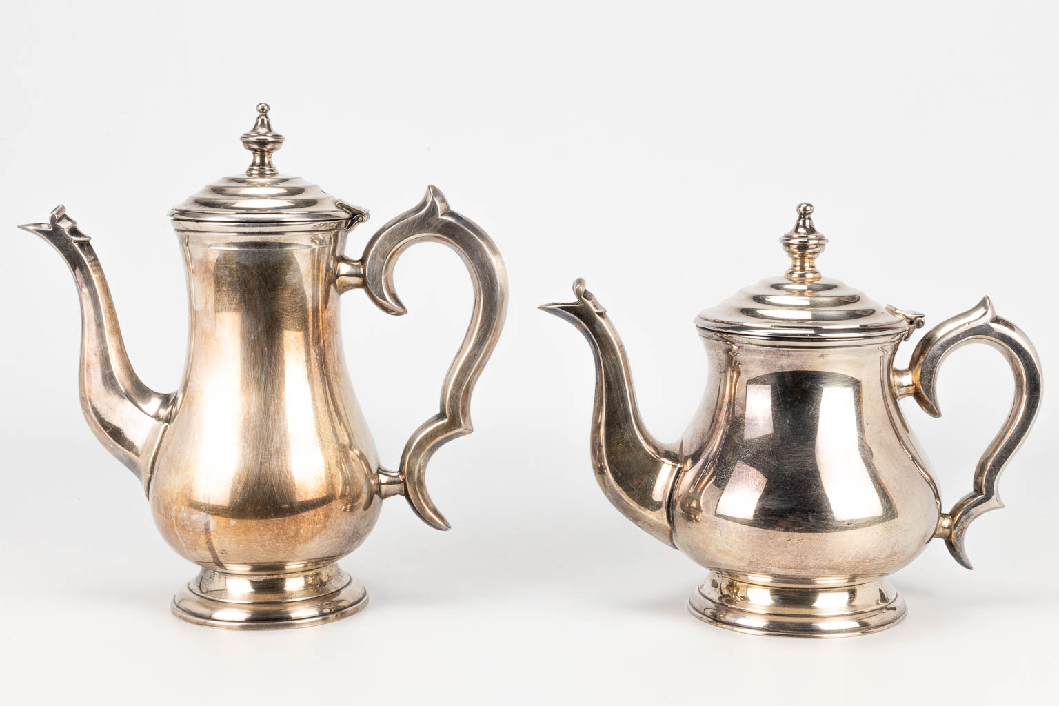 A coffee and tea service made of silver-plated metal. 