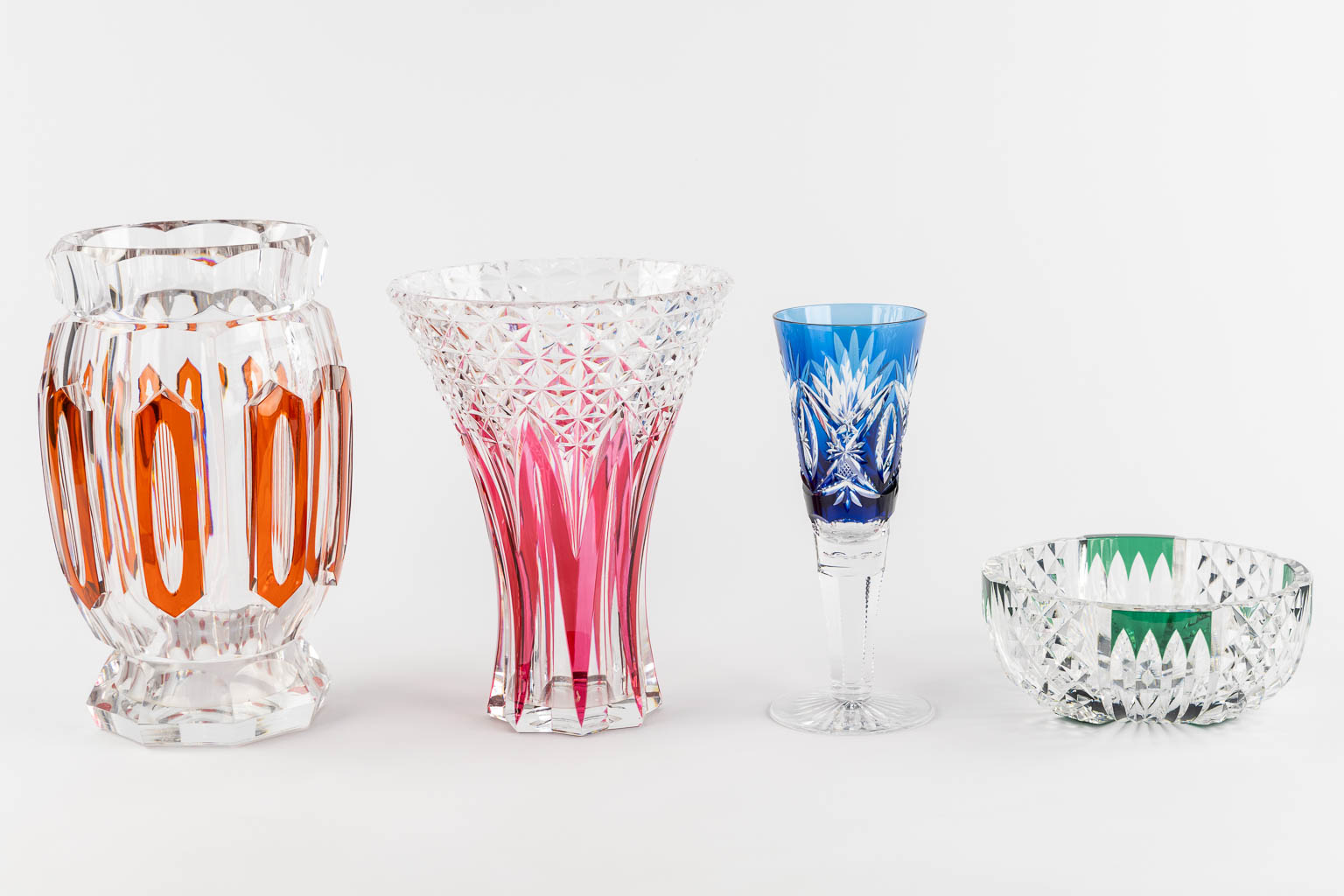 Val Saint Lambert, four pieces of cut and coloured crystal. (H:31 x D:19 cm)