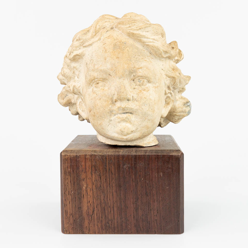 A head of a child made of terracotta. (H:14cm)