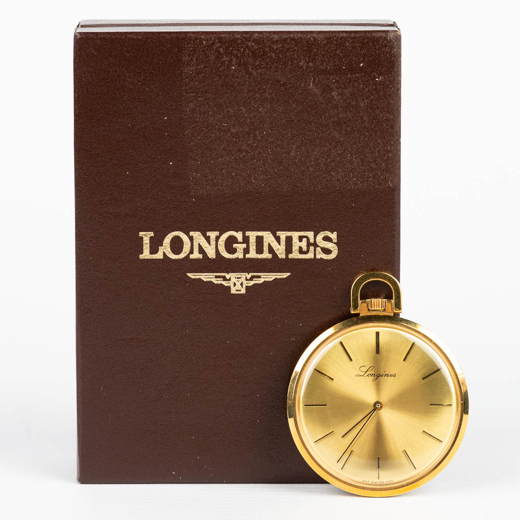 A mechanical pocket watch made by Longines, gold plated. 