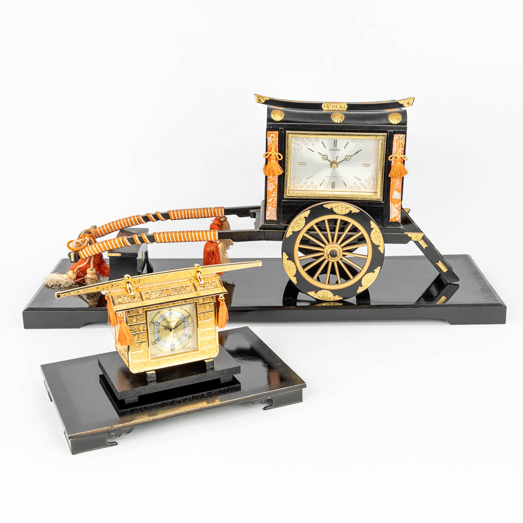 A collection of 2 clocks in Oriental style made by Citizen. (H:32cm)