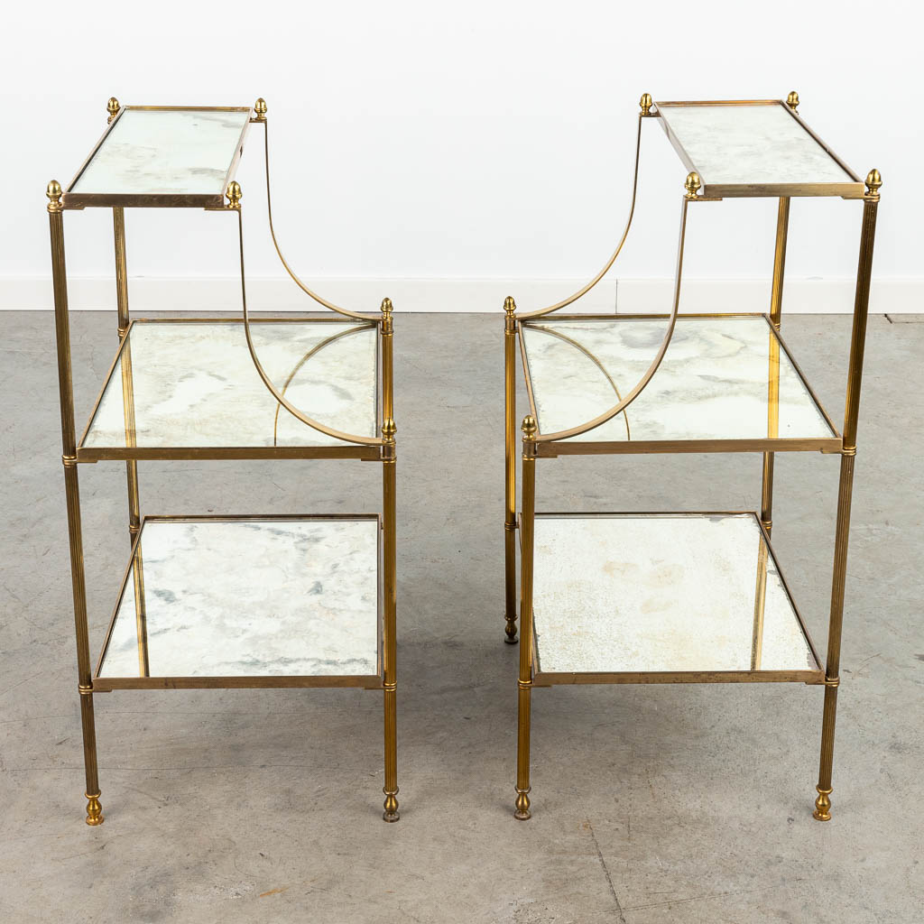 A pair of three tiers side tables made of brass and glass by Maison Jansen. (H:71cm)