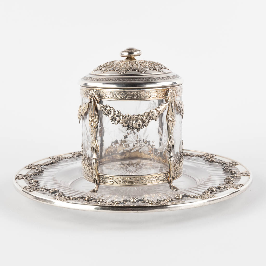 A small storage jar, glass mounted with silver, decorated with garlands. France. (H:13 x D:11,5 cm)