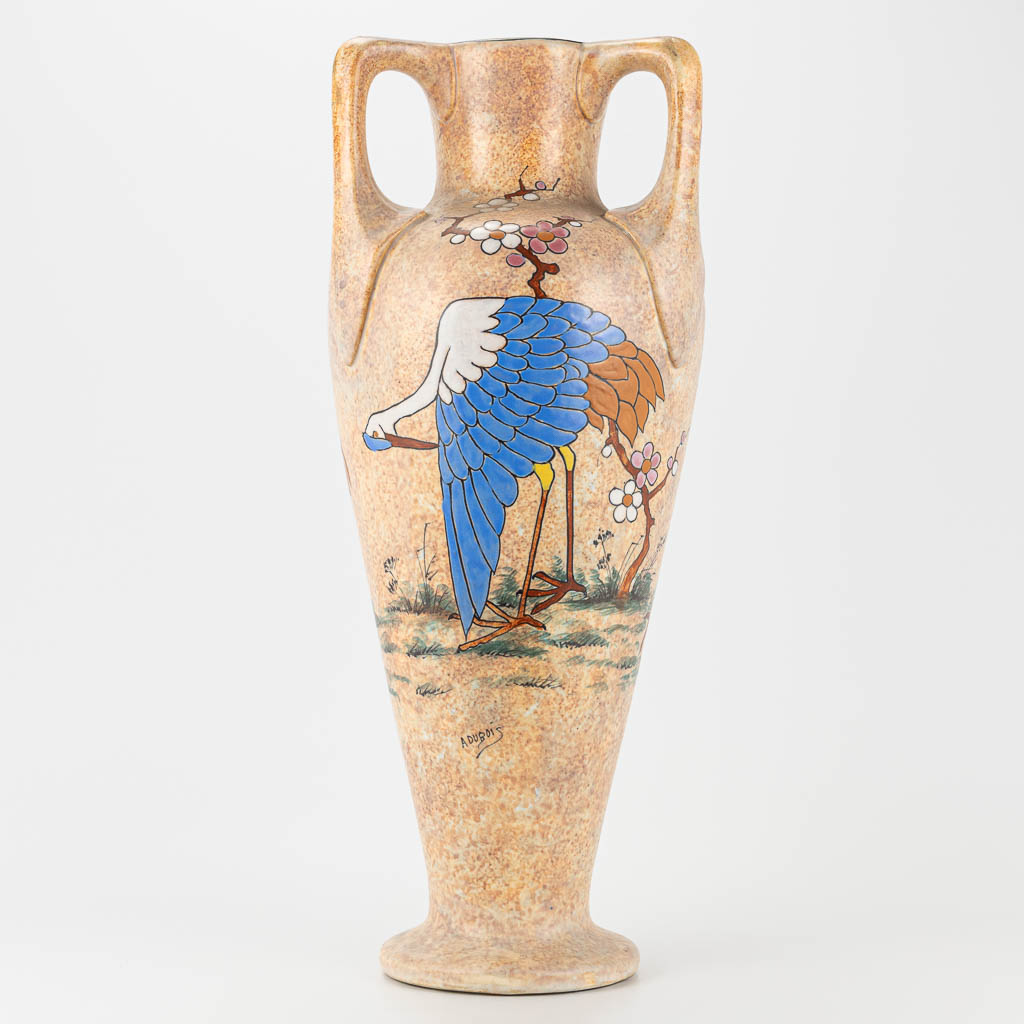 A ceramic amphora vase decorated with cranes and marked A. Dubois. Made in Belgium. 