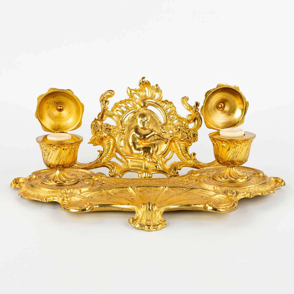 An antique inkwell with 2 pots, decorated with a satyr in Louis XV style and made of bronze. (H:14cm)