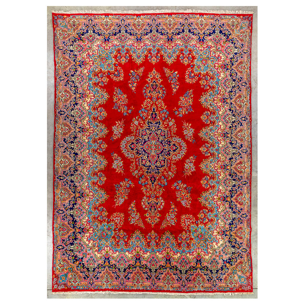 An Oriental hand-made carpet, Kerman. (305 x 415 cm)
