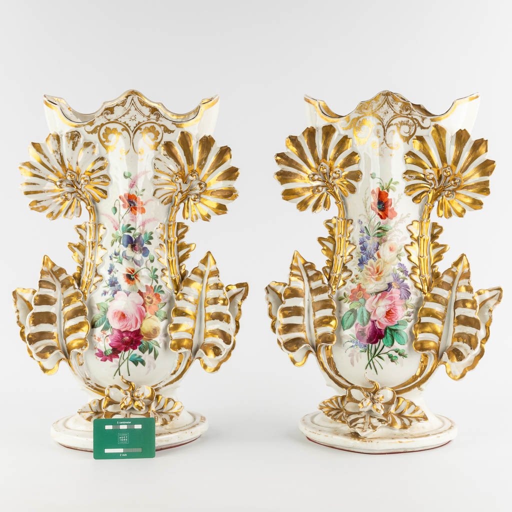 A pair of large Vieux Bruxelles porcelain vases with hand-painted flower decor. 19th C. (D:23 x W:36 x H:53 cm)