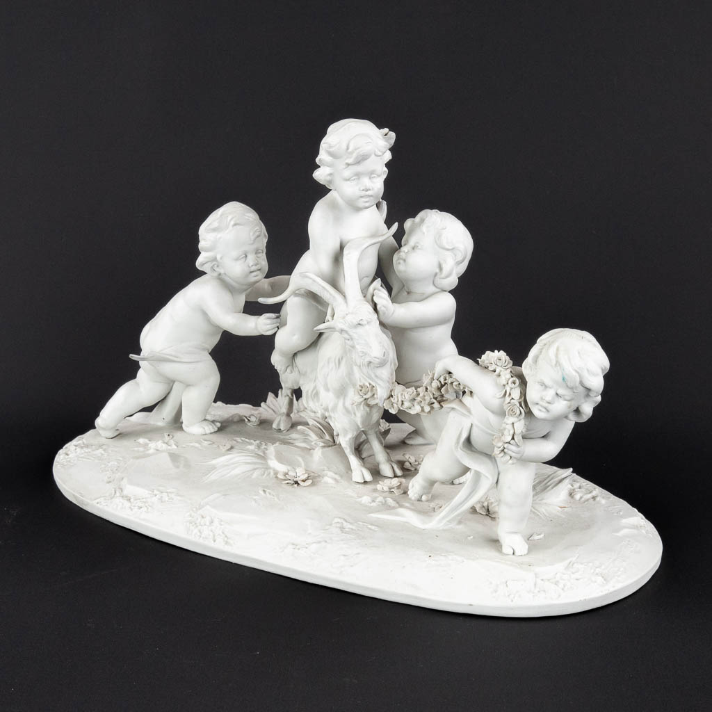 Rudolstadt Volkstedt, a porcelain group of putti with a Ram. (D:19 x W:36 x H:22 cm)