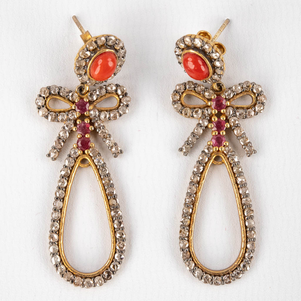 A pair of earrings, gilt silver with coral, ruby and old cut diamonds. 12,10g.