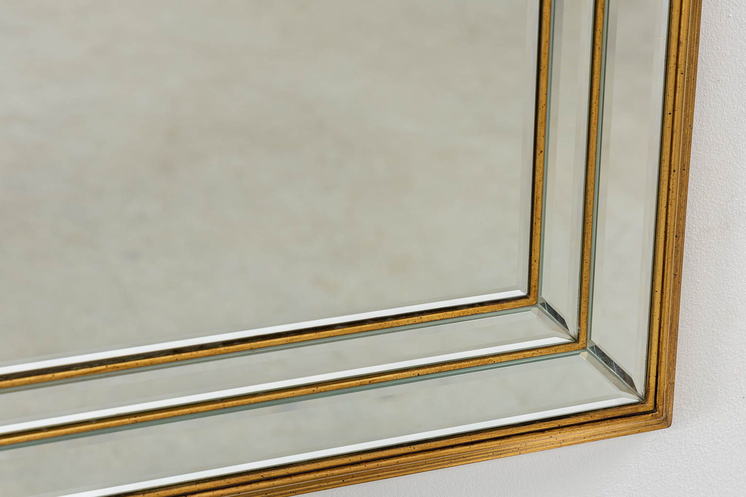 Deknudt, two mirrors. Gilt wood. (W:79 x H:125 cm)