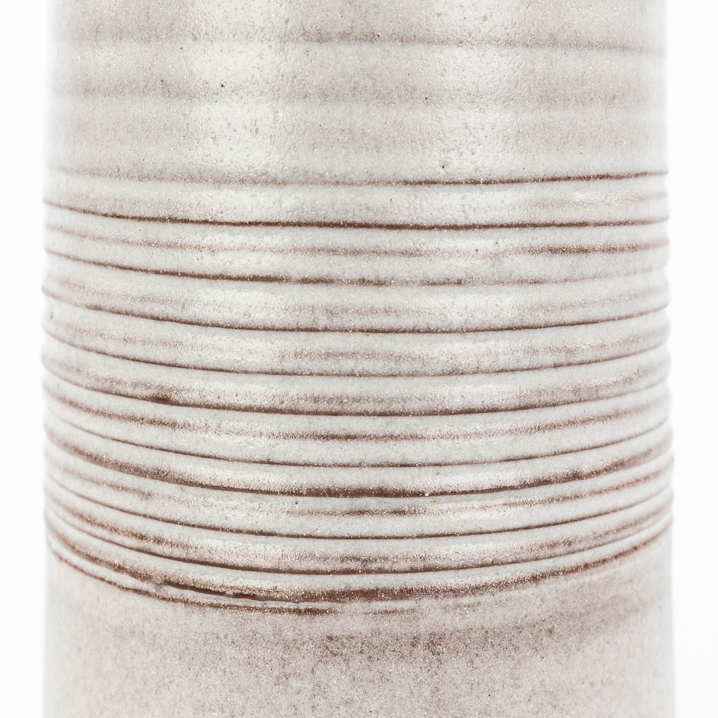 A mid-century vase made of white-glazed ceramics and marked Sanchez. (H:27cm)