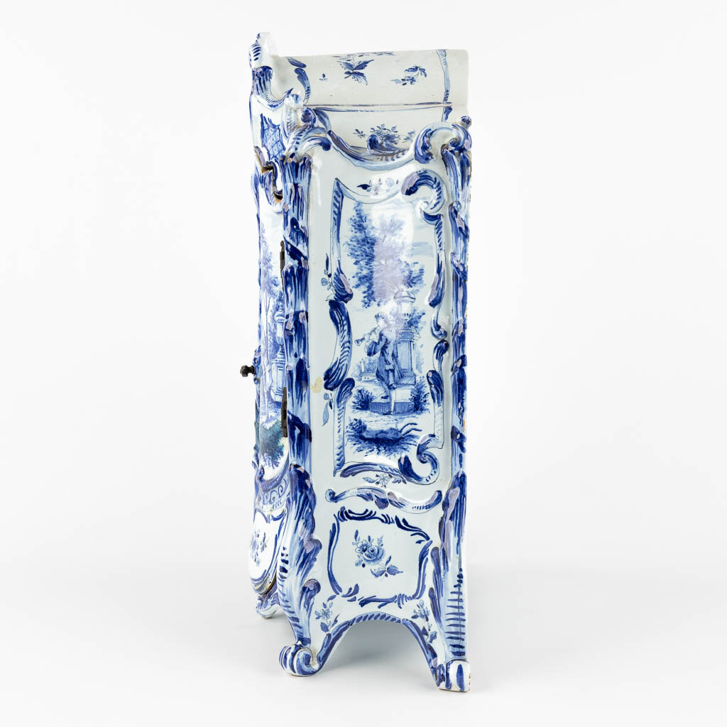 Delft, a miniature Linnen Cabinet, blue and white glazed faience. 19th C. (D:15 x W:28 x H:39 cm)