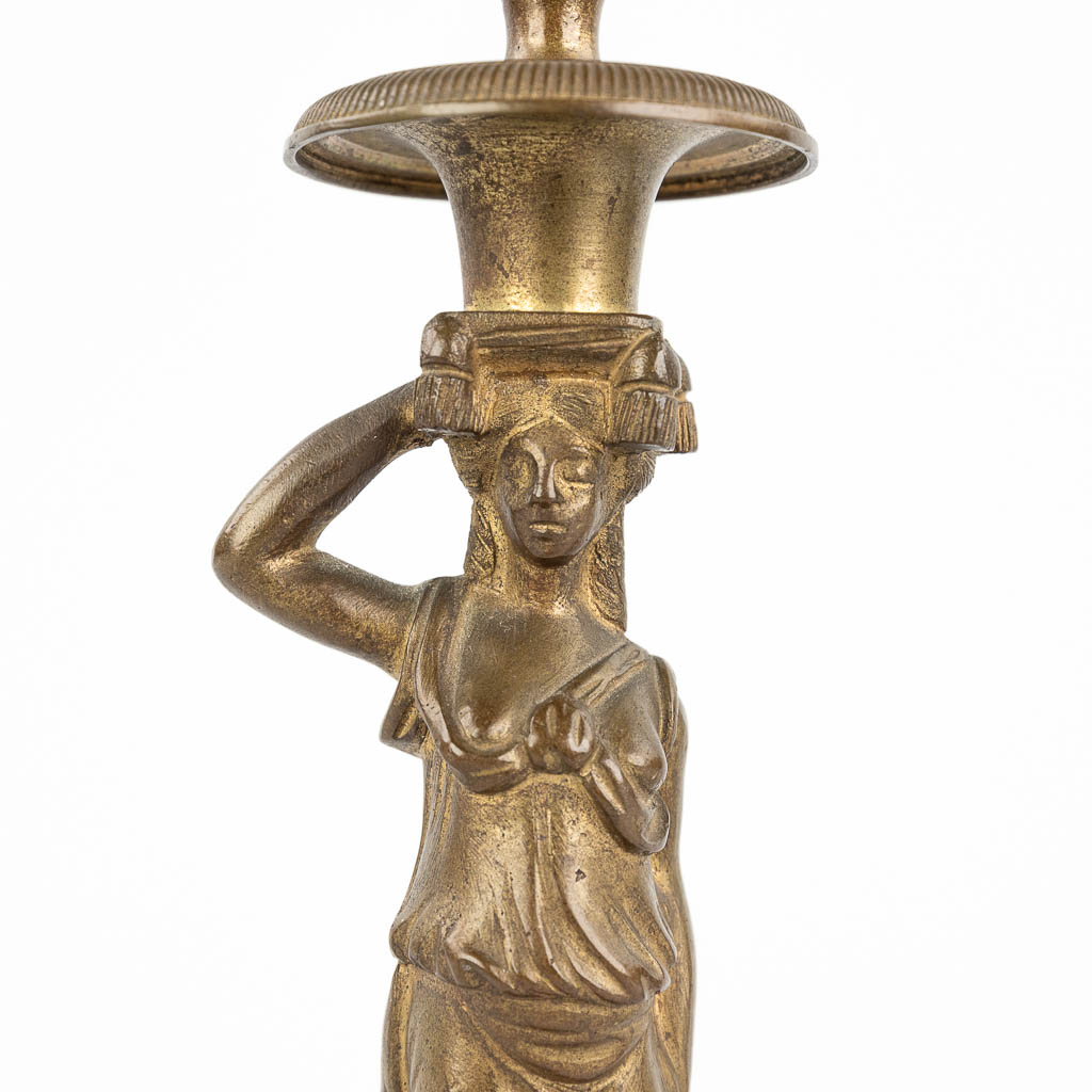 A pair of Karyatid candlesticks, bronze 19th C. (L: 8 x W: 8 x H: 24 cm)