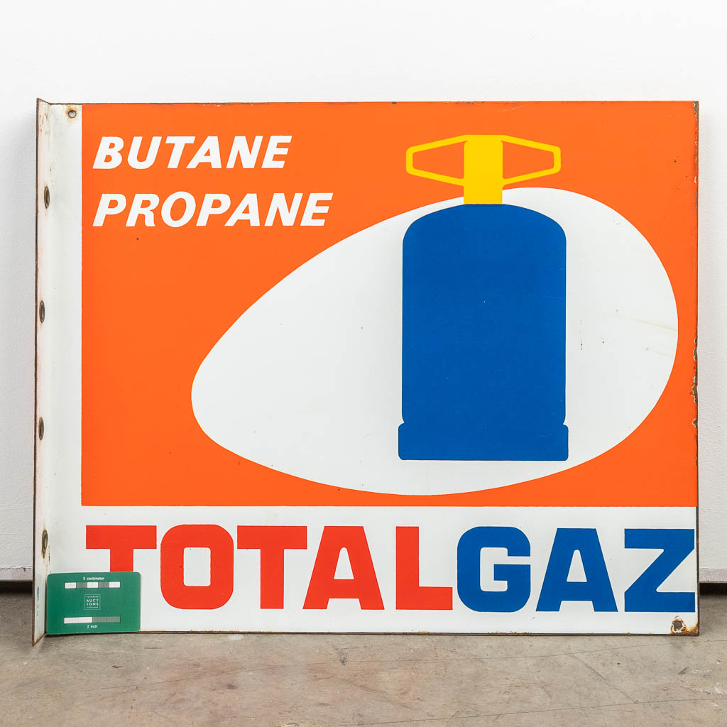 A double-sided enamel road sign 
