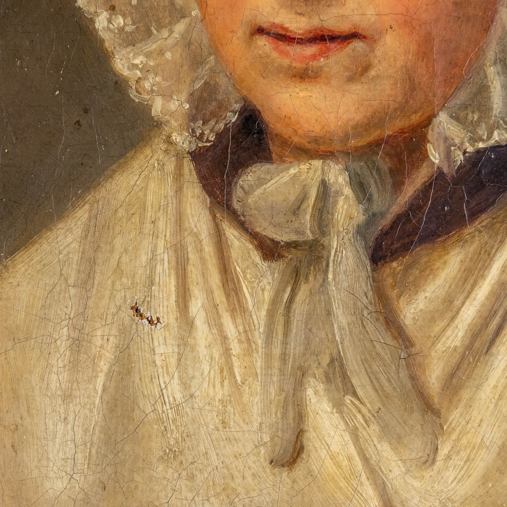 Een antiek portret van een dame, olie op doek. Geen handtekening gevonden. (W:18 x H:24 cm)