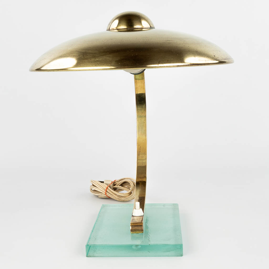 A table lamp made of metal and mounted on a glass base, in the style of Egon Hillebrand. The 1950s. (H:33cm)