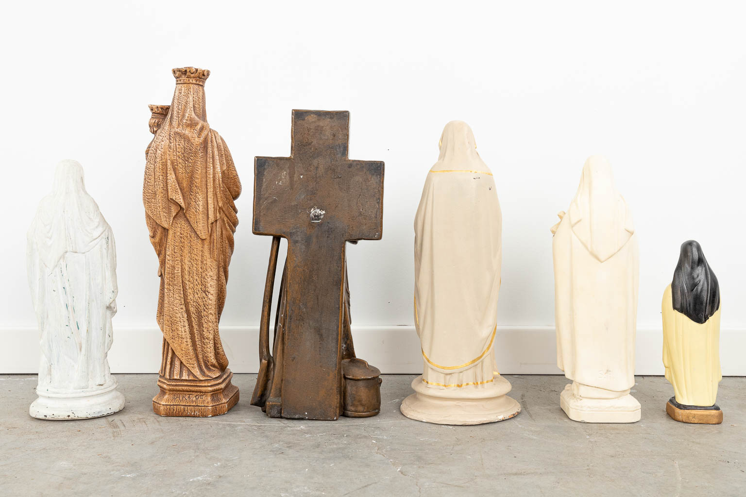 A large collection of statues of Holy figurines, made of polychrome and monochrome plaster and marble. (H:79cm)