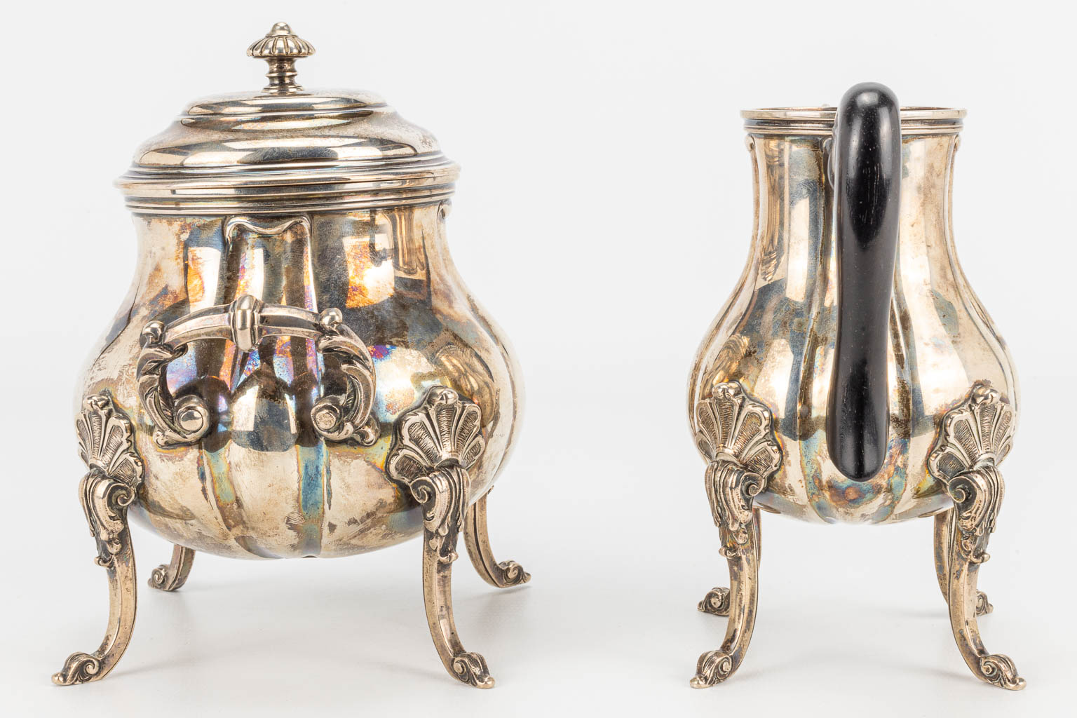 A coffee and tea service made of silver and marked 800 and Delheid Frères. 