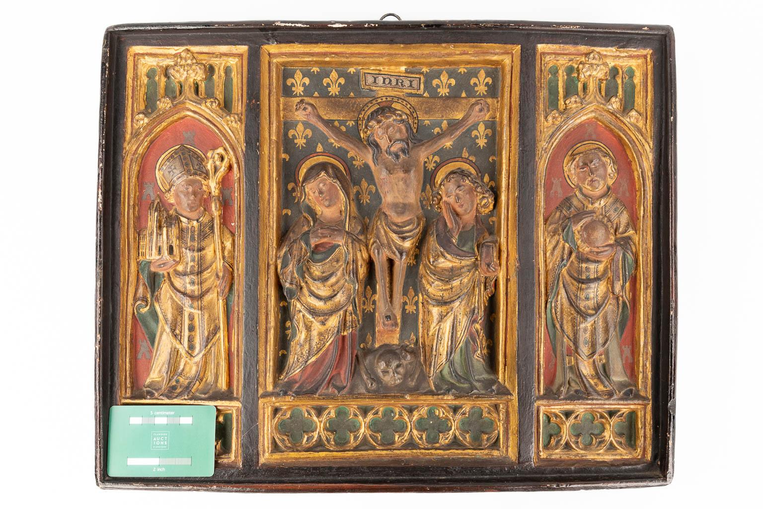A religious Triptych made of patinated plaster in gothic revival style. 20th C. (W: 46 x H: 37 cm)