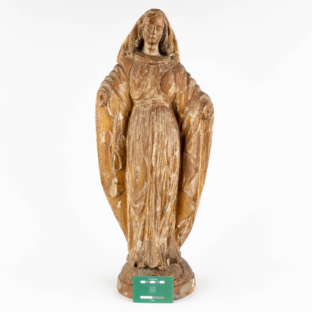 A wood-sculptured Madonna, remains of the original patina. 18th C. (D:15 x W:26 x H:62 cm)