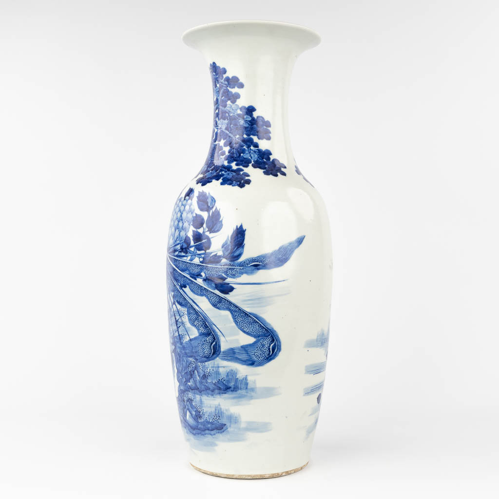 A Chinese vase with blue-white decor of a Phoenix and Cranes. 19th/20th C. (H: 61 x D: 23 cm)