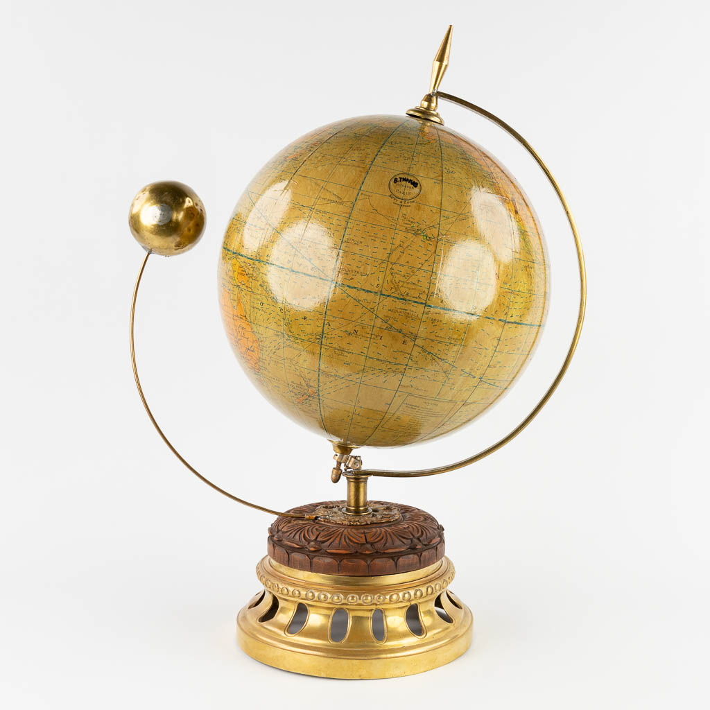 G. Thomas, a globe with a moon, mounted on a brass base. (W:43 x H:59 x D:30 cm)