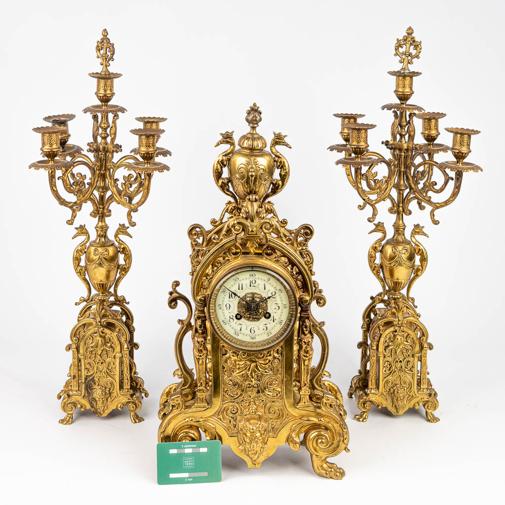 A three-piece mantle clock made of bronze. (H:50cm)