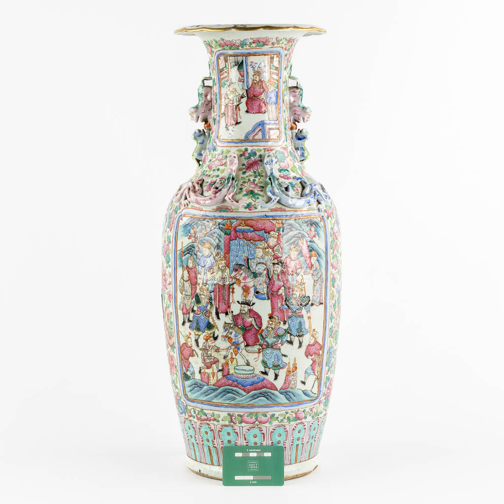 A Chinese Famille Rose vase decorated with figurines. (H:63,5 x D:23 cm)