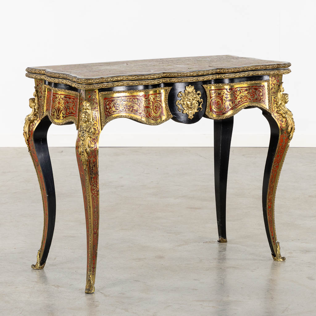 A 'Boulle inlay' card playing table mounted with gilt bronze, Napoleon 3, 19th C. (L:45 x W:87 x H:74 cm)