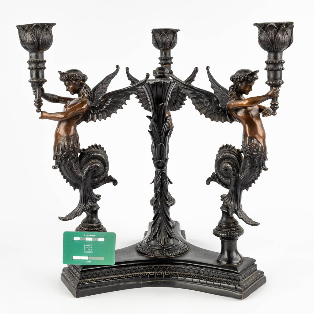 A large table candelabra decorated with three 