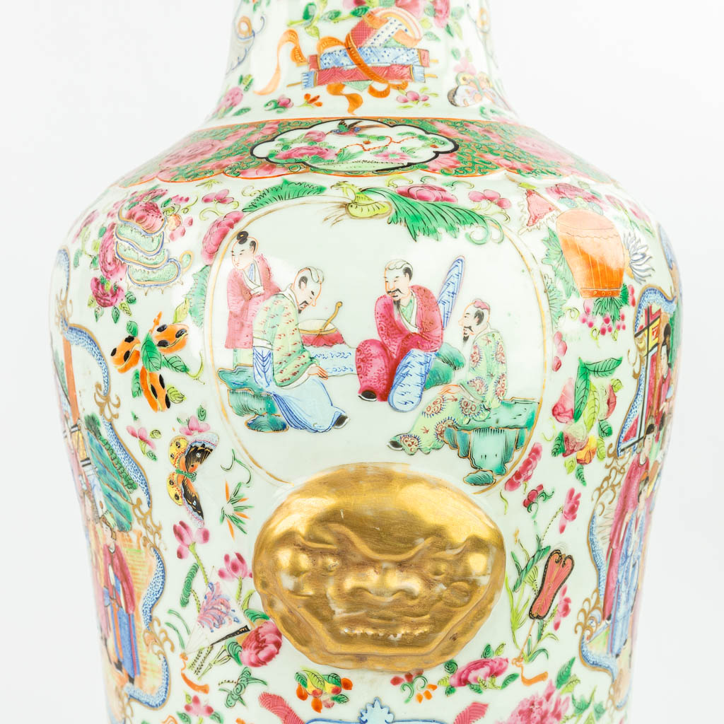 A pair of Chinese Canton vases made of porcelain and decorated with images of 'The Chinese Life' and medallions. (H:6