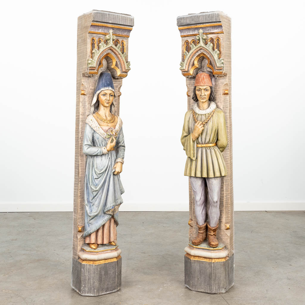 A pair of mid-century side pieces for a fireplace mantle made of patinated plaster, Medieval scène. (H:120cm)