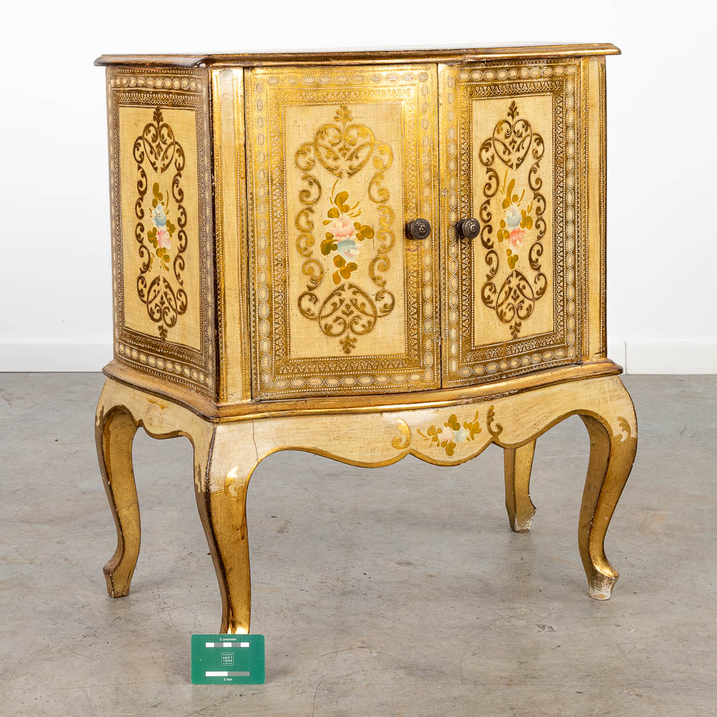A two-door side cabinet made of gilt wood. (H:73cm)