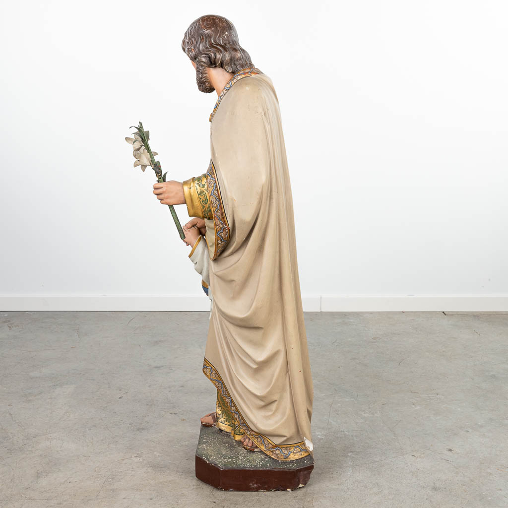 A statue of Joseph and Jesus with a Globus Cruciger made of patinated plaster. (H:110cm)