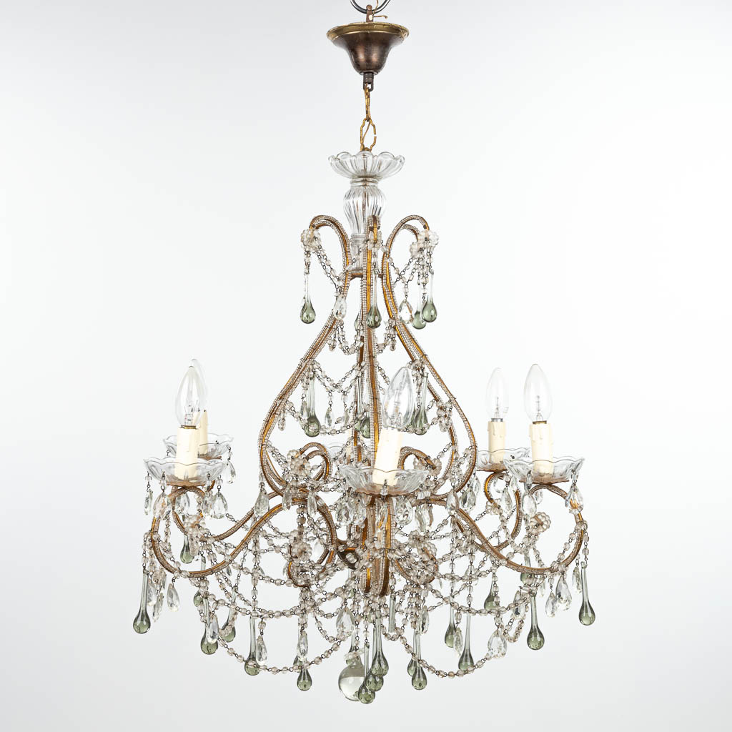 A decorative chandelier made of brass and glass. (H:70cm)